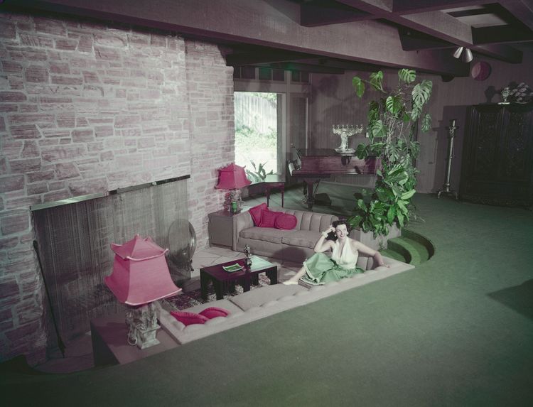 American actress Jane Russell (1921 - 2011) in the sunken living room or 'conversation pit' at her home, circa 1950. 