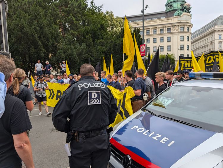 Police car and police officer at demonstration.