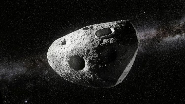 Eine künstlerische Darstellung eines Asteroiden im Weltraum mit mehreren sichtbaren Einschlagkratern vor dem Hintergrund der Sterne der Milchstraße.