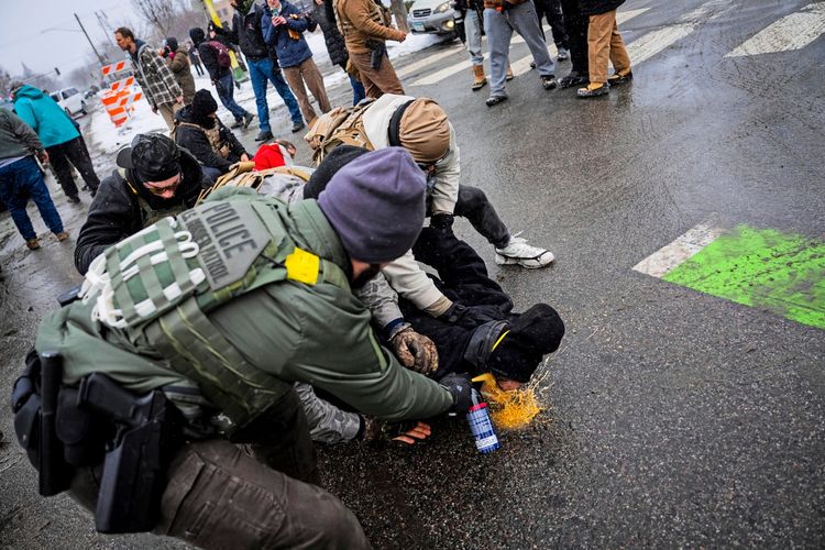 Pepper-Sprayed While Pinned Down: A Searing Scene Provokes Outrage ...