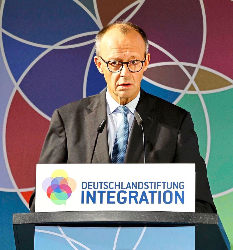 Protest gegen deutschen Kanzler Merz bei Integrations-Rede