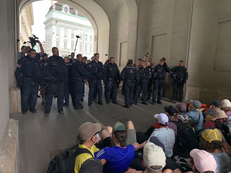 Protesters at a sit-in, opposite police.